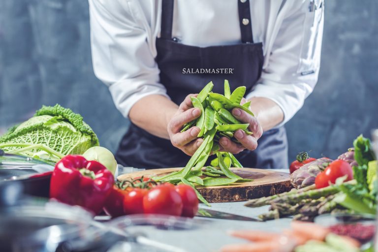 Preparing fresh vegetables to be cooked in Saladmaster’s premium non-toxic cookware, ideal for healthy, chemical-free meals.