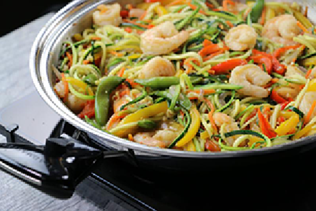 Saladmaster 11 inch skillet with prawn and vegetable stir fry on white benchtop