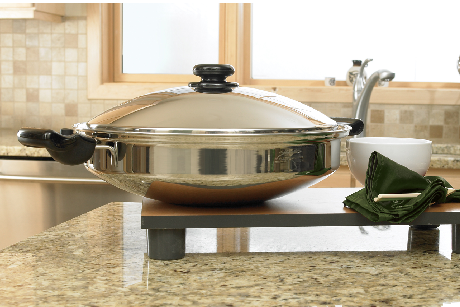 Saladmaster 12 quart wok on kitchen benchtop with bowl and sink in background, non-toxic stainless steel cookware